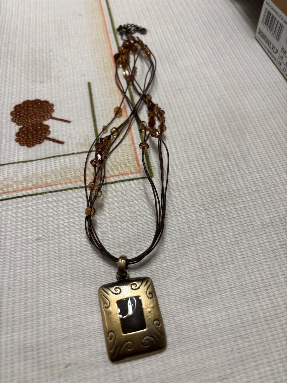 Bronze-tone Rectangular Pendant Necklace with Brown Beaded Multi-Strand Cord